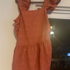 Orange ruffle sleeve top